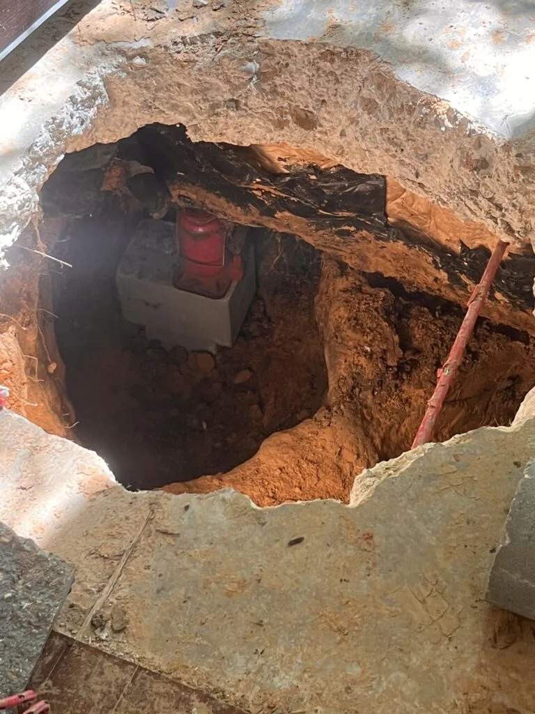 Large opening cut through a concrete floor